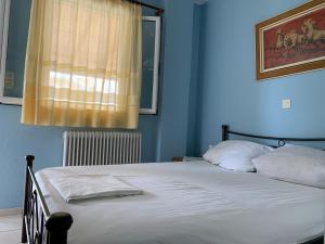 Posteľ alebo postele v izbe v ubytovaní Alexandras Appartments + 10 fotografií