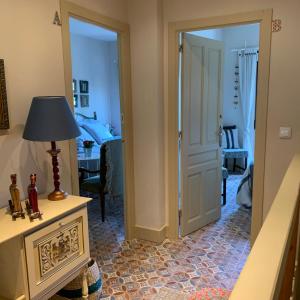 a room with a door leading to a bedroom at Antigua alqueria reformada in Valencia
