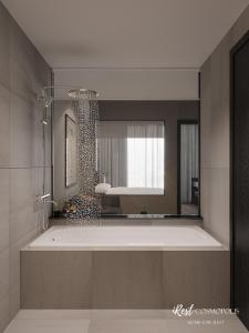 a bathroom with a large tub and a mirror at iRest COSMOPOLIS Vinh Yen in Yen
