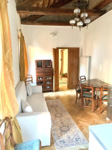 a living room with a white couch and a table at Ca Dode Grand Canal in Venice +26 photos