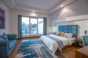 A bed or beds in a room at Asahalah Farm Pool Villas