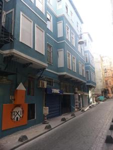a blue building on the side of a street at TAXİM HOSTEL in Istanbul