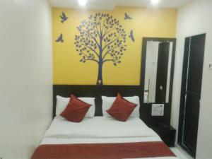 Postel nebo postele na pokoji v ubytování Hotel Guestinn Residency
