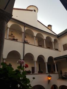 a building with arches and a building with a flower at be at home with Philip & Marie in Klagenfurt