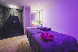 Ein Bett oder Betten in einem Zimmer der Unterkunft Gara Suites Golf & Spa