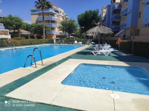 a swimming pool in a building with a swimming pool at Casa KIKO, LA CASA ESTA EN LA ANTILLA 200METROS PLAYA in La Antilla