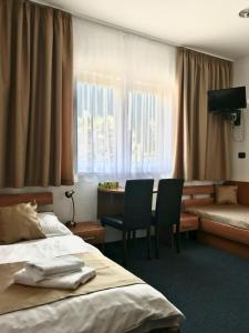 Postel nebo postele na pokoji v ubytování Hotel Remy + 37 fotografií