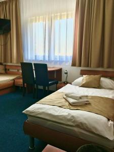 Posteľ alebo postele v izbe v ubytovaní Hotel Remy
