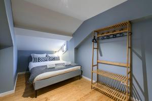 a bedroom with a bunk bed and a ladder at GuestReady - Miragaia Rooftop in Porto