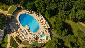 an aerial view of a large swimming pool with a bunch of camping at Valamar Diamant Hotel in Poreč