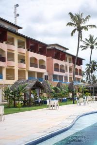 a hotel with a swimming pool and a resort at Costa Brava Praia Hotel in Lucena
