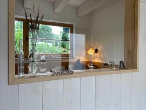 a kitchen with a window and a white counter top at Ferienhaus angelangt Prerow in Prerow