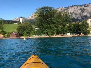 a view from the inside of a kayak in the water at Attersee-Chalet Angermann Familie Spalt in Steinbach am Attersee