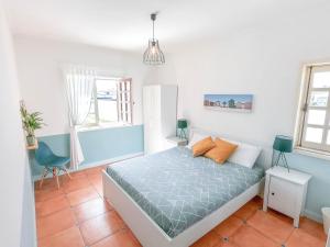 Ένα ή περισσότερα κρεβάτια σε δωμάτιο στο OLA Guesthouse