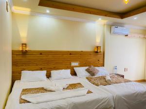 Postel nebo postele na pokoji v ubytování Mariana Maldives