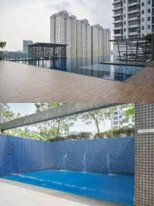 two pictures of a balcony with a blue fence and buildings at Usj One Residence @ Homestay in Subang Jaya