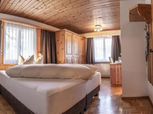 מיטה או מיטות בחדר ב-Hotel Garni Panorama