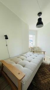 a bedroom with a bed and a lamp at ApartmentInCopenhagen Apartment 1461 in Copenhagen