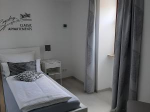 Postel nebo postele na pokoji v ubytování Bugenhagen - Classic Appartements