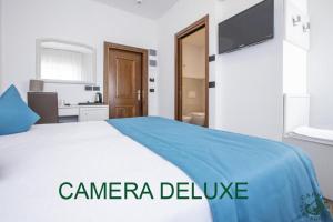 Giường trong phòng chung tại Albergo Cappello e Cadore
