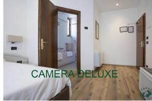 Giường trong phòng chung tại Albergo Cappello e Cadore