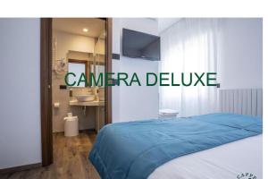 Giường trong phòng chung tại Albergo Cappello e Cadore