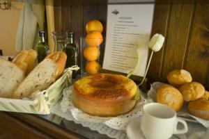 a bunch of different types of bread on a table at Hotel Brisa in A Coruña