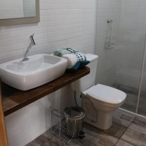 a bathroom with a sink and a toilet at Casa Goethe - Bio Cult in Campo Alegre