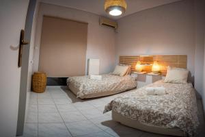 Ένα ή περισσότερα κρεβάτια σε δωμάτιο στο It is a pleasant, modern, functional house!