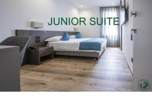 Giường trong phòng chung tại Albergo Cappello e Cadore