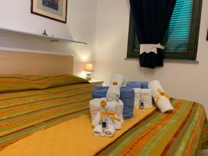 Postel nebo postele na pokoji v ubytování Villa Tonino 150 mt dal mare e grande spiaggia