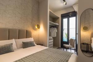 A bed or beds in a room at Malaga a Tu Ritmo! Edificio muy tranquilo y moderno!