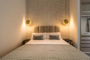 A bed or beds in a room at Malaga a Tu Ritmo! Edificio muy tranquilo y moderno!