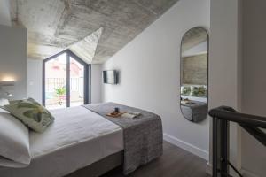 A bed or beds in a room at Malaga a Tu Ritmo! Edificio muy tranquilo y moderno!