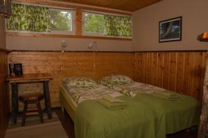 Postel nebo postele na pokoji v ubytování Hotel Korpikartano
