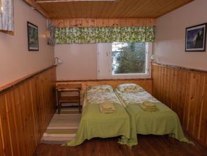Postel nebo postele na pokoji v ubytování Hotel Korpikartano