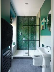 a bathroom with a shower and a toilet and a sink at The Prince of Waterloo - Boutique Guest Rooms in Winford