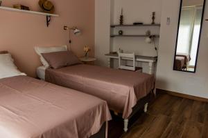Posteľ alebo postele v izbe v ubytovaní LORA GIUSTA GUEST HOUSE