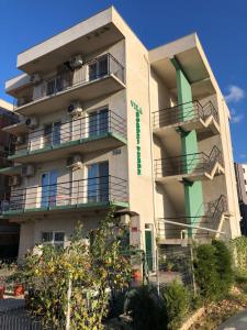 a building with balconies on the side of it at Vila Bordei Verde in Mamaia Sat/Năvodari
