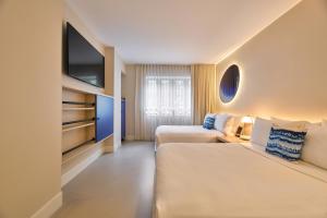 Postel nebo postele na pokoji v ubytování Hotel Greystone - Adults Only