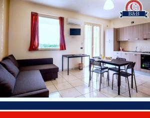 Kuchyň nebo kuchyňský kout v ubytování B&B Caravello