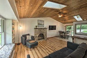 a living room with a couch and a fireplace at Home - 2 Blocks to Lake Nagawicka Boat Launch in Delafield