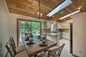 a kitchen with a dining room table with chairs at Home - 2 Blocks to Lake Nagawicka Boat Launch in Delafield