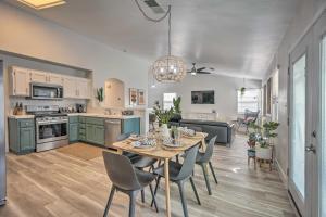 a kitchen and dining room with a table and chairs at Stylish Bakersfield Getaway with Pool Table! in Bakersfield