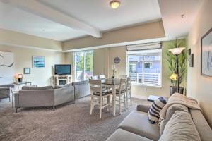 a living room with a couch and a table at Grand Haven Condo with Patio Less Than 1 Mi to Downtown in Grand Haven