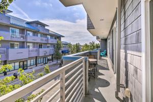 a balcony with a view of a building at Grand Haven Condo with Patio Less Than 1 Mi to Downtown in Grand Haven