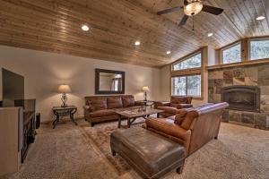 a living room with leather furniture and a fireplace at Soda Springs Cabin Near Donner Lake and Ski Resorts! in Soda Springs