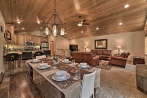 a dining room and living room with a table and chairs at Soda Springs Cabin Near Donner Lake and Ski Resorts! in Soda Springs