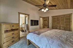 a bedroom with a bed and a ceiling fan at Soda Springs Cabin Near Donner Lake and Ski Resorts! in Soda Springs