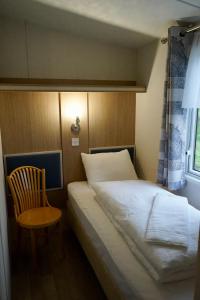 Postel nebo postele na pokoji v ubytování Birkifell II